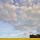 Photo d'un champ de blé sous un ciel nuageux en Haute Savoie