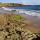 Photographie de rochers de d'une plage de sable en Bretagne près de Guidel