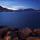 Photographie des couleurs de l'aube sur le lac d'Annecy entouré de montagnes