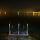 Image de la tombée de la nuit sur le lac d'Annecy et la plage d'Albigny