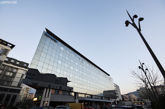 Winter evening light on the Novotel hotel in Annecy