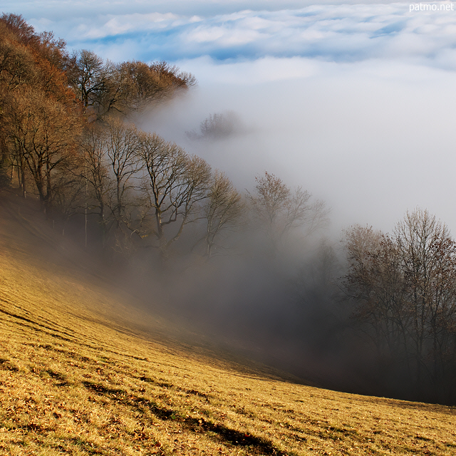 Photo of Vuache mounatin with winter mist and clouds