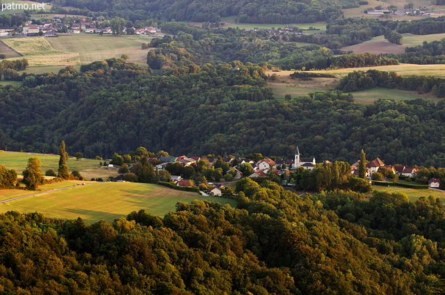 Photograph of the hills around Musièges village bathed in the evening light