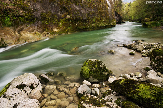 Springtime landscape and powerful flow in Cheran river