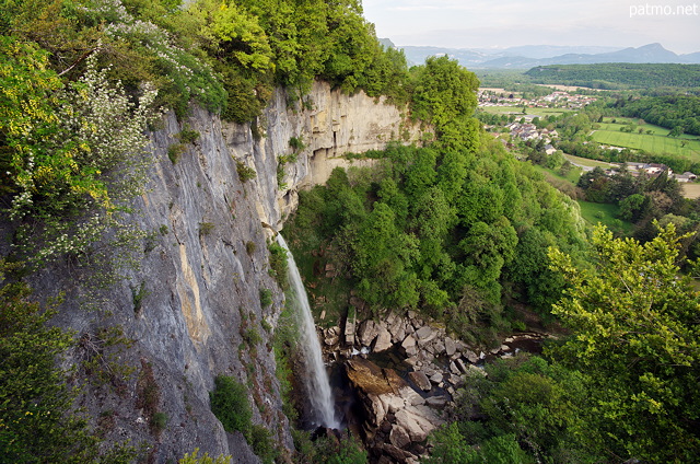 Photo of a springtime landscape in Valromey countryside with Cerveyrieu waterfall and Seran river