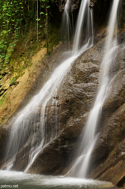 Photo of a waterfall on the banks of Cheran river in summer