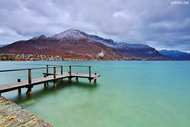 Picture with Annecy lake, Veyrier mountain and first autumn snow