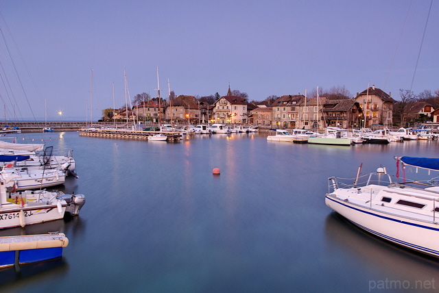 Photo of Nernier village and Geneva lake in dusk light