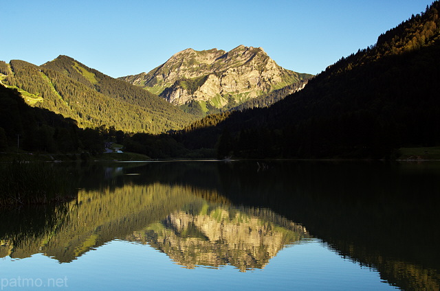 Photograph of lake Vallon in Bellevaux and Roc d'Enfer mountain