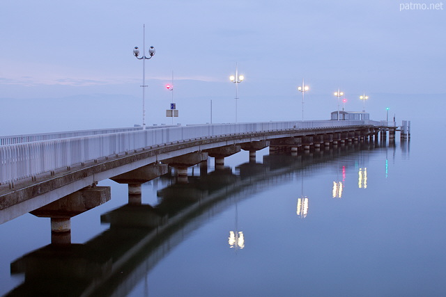 Picture of dusk and public lights on the deck on Geneva lake in Thonon les Bains