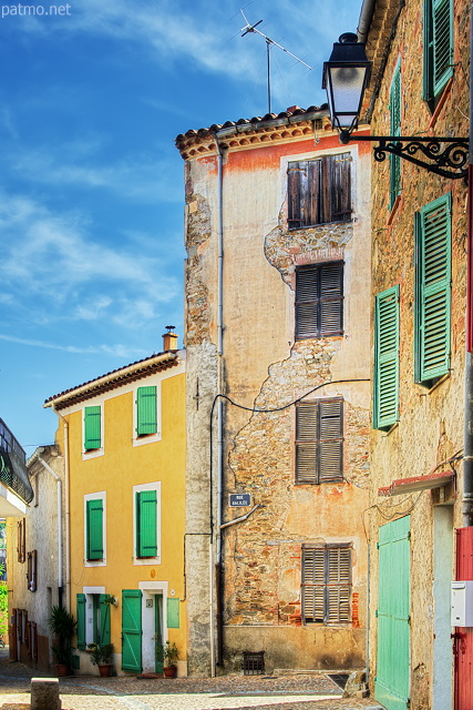 HDR image of some colorful houses in the streets of Collobrieres in Provence