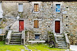 Photo de la faade colore d'une maison de village  Ghisoni en Haute Corse