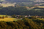 Photograph of the hills around Musiges village bathed in the evening light