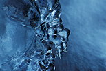 Photograph of tiny ice stalactites over the water of Fornant river