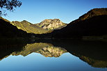 Image of lake Vallon with Roc d'Enfer mountain reflection