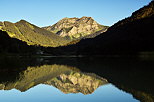 Photograph of lake Vallon in Bellevaux and Roc d'Enfer mountain