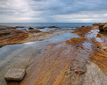 Image of the mediterranean sea under a cloudy sky at Bau Rouge beach in Provence