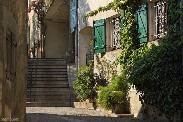 Picture with light and shadow on the houses of Cogolin village in Provence
