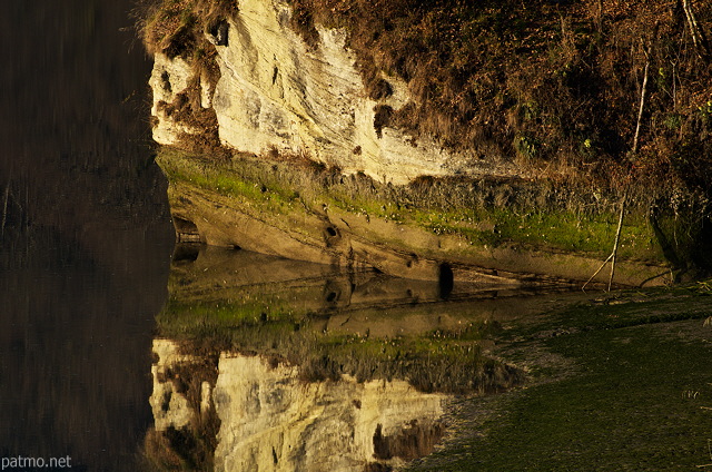 Photograph of reflections on the water of Rhone river near Bassy