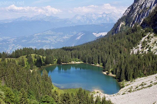 Image of an alpine lake in Massif des Bornes mountains