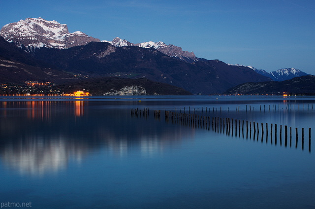 Photo of Annecy lake and Tournette mountain by a springtime dusk in Sevrier