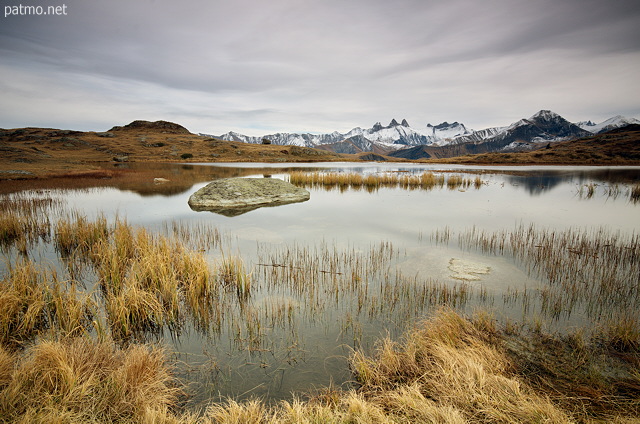 Image of Guichard lake and Aiguilles d'Arves mountains in autumn