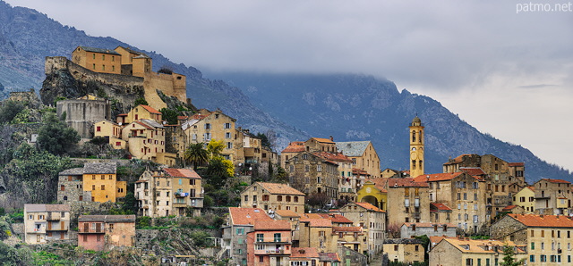 Image of the old city of Corte under the clouds of a winter morning