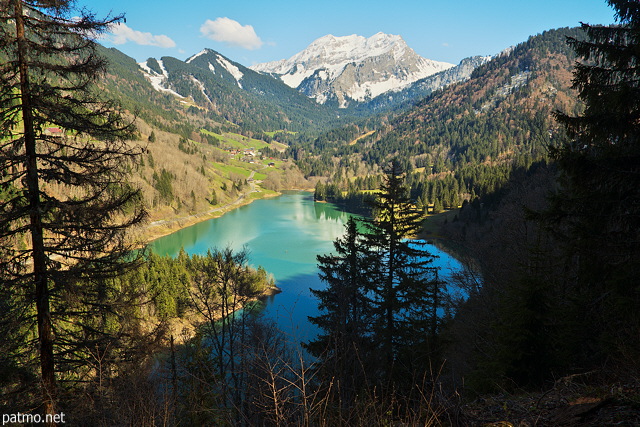 Image of a springtime landscape around lake Vallon and Roc d'Enfer mountain in Bellevaux