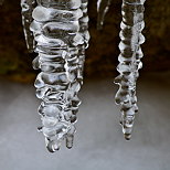 Closeup on ice stalactites above Fornant river