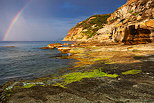 Photo of a rainbow on the Mediterranean sea at Bau Rouge beach in Provence