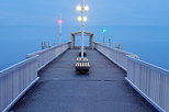 Photo of Geneva lake at blue hour from the pier of Thonon les Bains