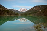 Picture of a springtime evening in Bellevaux with Vallon lake and Roc d'Enfer mountain