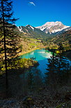 Image of Vallon lake and snow on Roc d'Enfer mountain